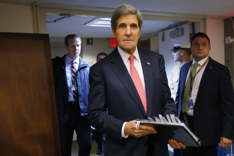 Secretary of State John Kerry enters the room for a news conference at the U.S. Embassy in Tel Aviv, Dec. 13, 2013.