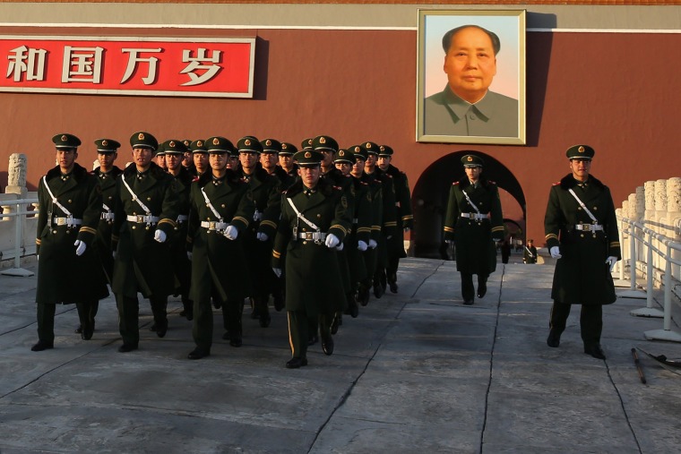 Paramilitary policemen patrol in front of Tiananmen Gate on Nov. 17, in Beijing, China.