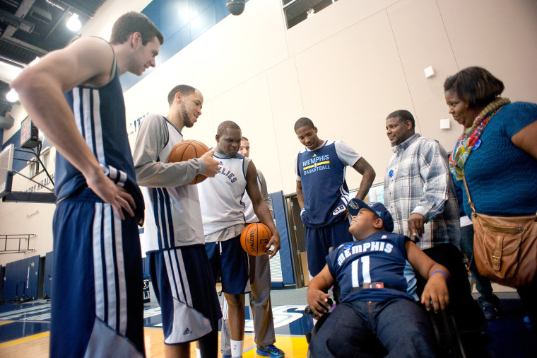Memphis Grizzlies players surrounded Charvis Brewer before practice on Sunday. Charvis had all sorts of tips to share with them.
