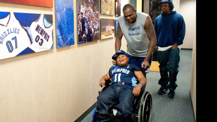 Make-A-Wish recipient Charvis Brewer and his older brother, Nicholas, get a behind-the-scenes tour from Memphis Grizzlies basketball player Zach Randolph.