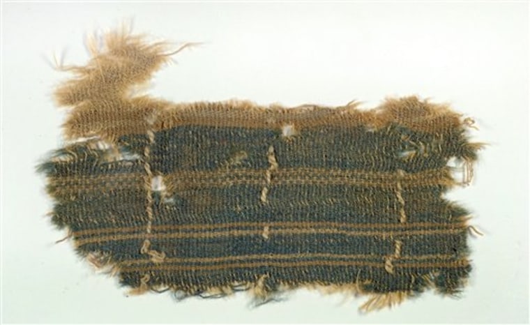 This undated photograph released by the Israel’s Antiquities Authority Tuesday, Dec. 31, 2013, shows a nearly 2,000-year old textile that appears to c...
