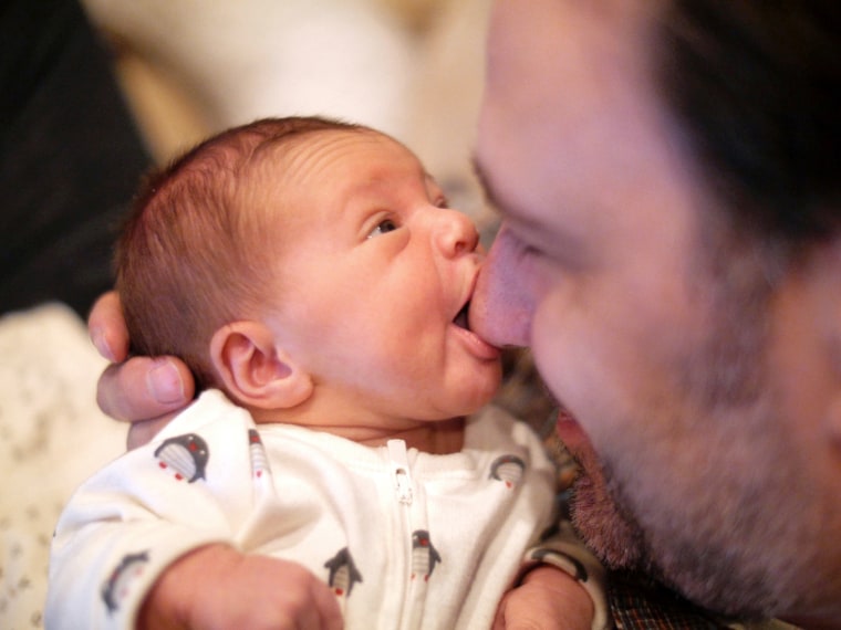 New dad Christian Williams, with daughter Marlowe, says that learning he was becoming a father will always be how he remembers the Boston Marathon.