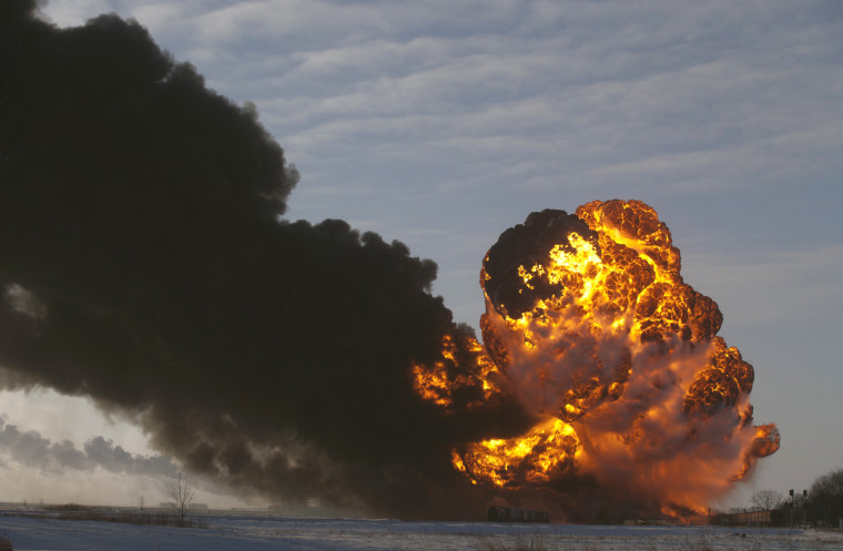 A fireball erupts at the site of an oil train derailment, on Monday, in Casselton, N.D.