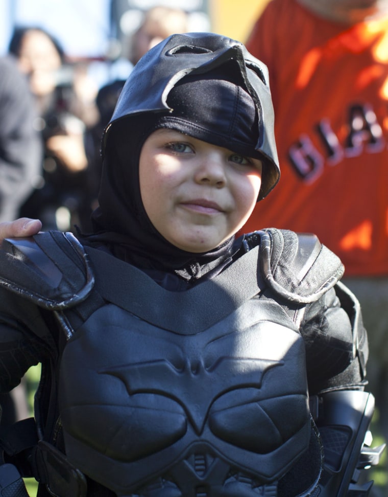 Leukemia survivor Miles, 5, dressed as BatKid, visits AT&T Park as part of a Make-A-Wish foundation fulfillment November 15, 2013 in San Francisco. The Make-A-Wish Greater Bay Area foundation turned the city into Gotham City for Miles by creating a day-long event bringing his wish to be BatKid to life. (Photo by Ramin Talaie/Getty Images)