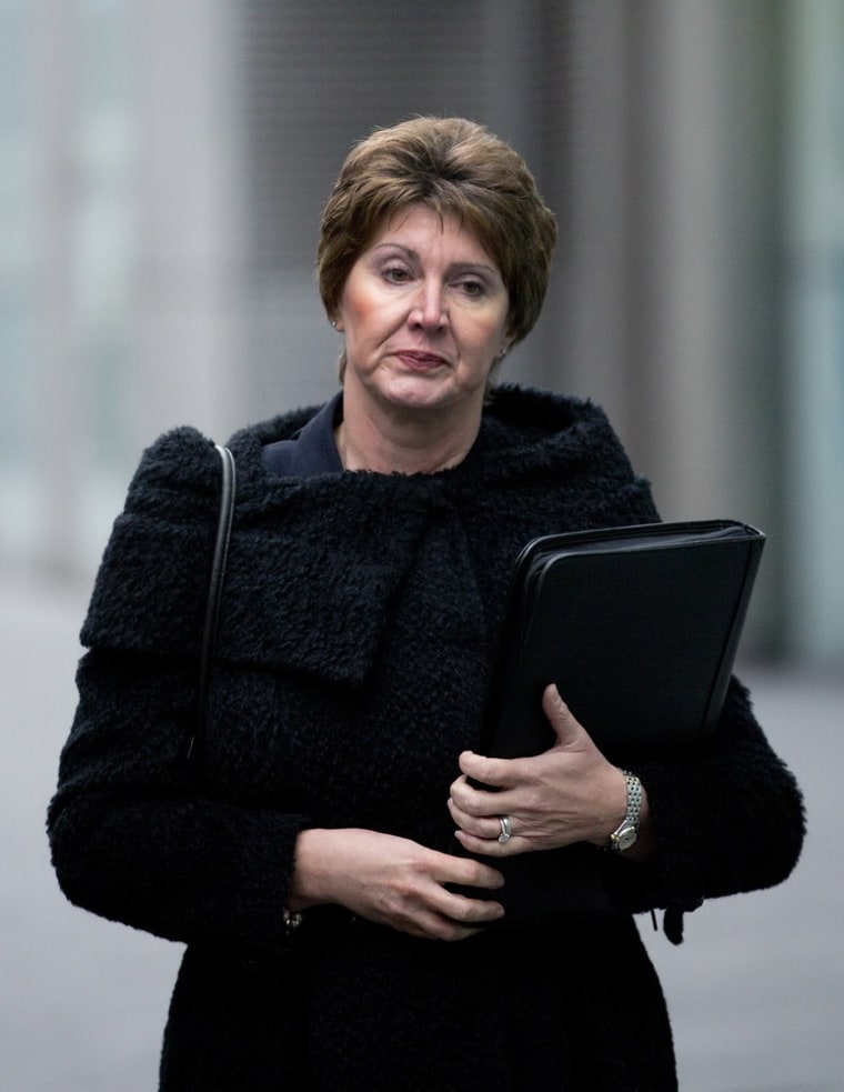Detective Chief Inspector April Casburn of the London Metropolitan Police walks into Southwalk Crown Court in London, Monday, Jan. 7, 2013. Casburn is accused of offering the now-defunct tabloid, The News of the World information about Operation Varec, the investigation into whether Scotland Yard's inquiry into phone hacking should be reopened. (AP Photo/Alastair Grant)