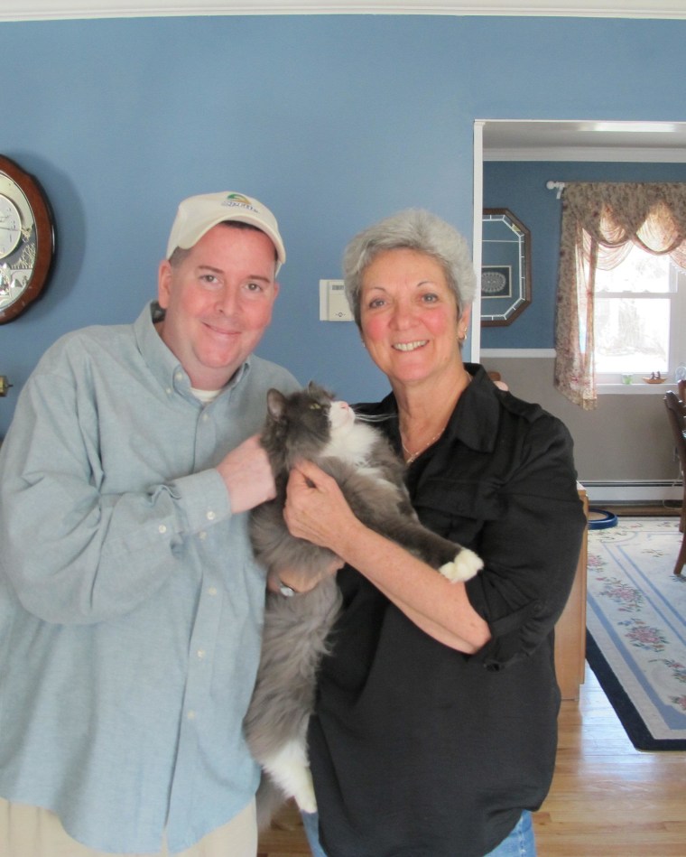 McGee poses with his East Islip, N.Y., owner Charlene Lanigan and the Long Island resident who found him, Bobby Boyle.