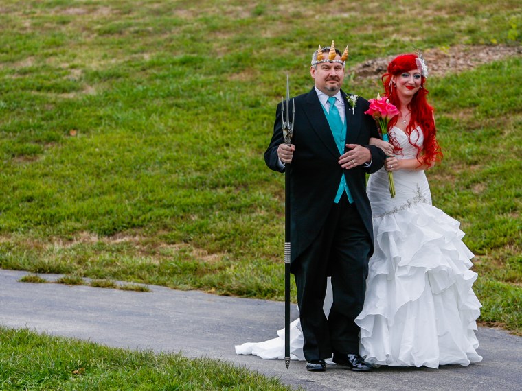 The bride's father dressed as King Triton to walk her down the aisle.