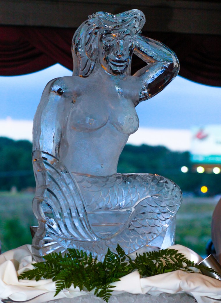 An ice mermaid takes center stage at the reception.