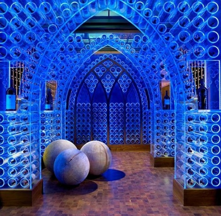 The wine cellar has lights that can be changed to different colors.