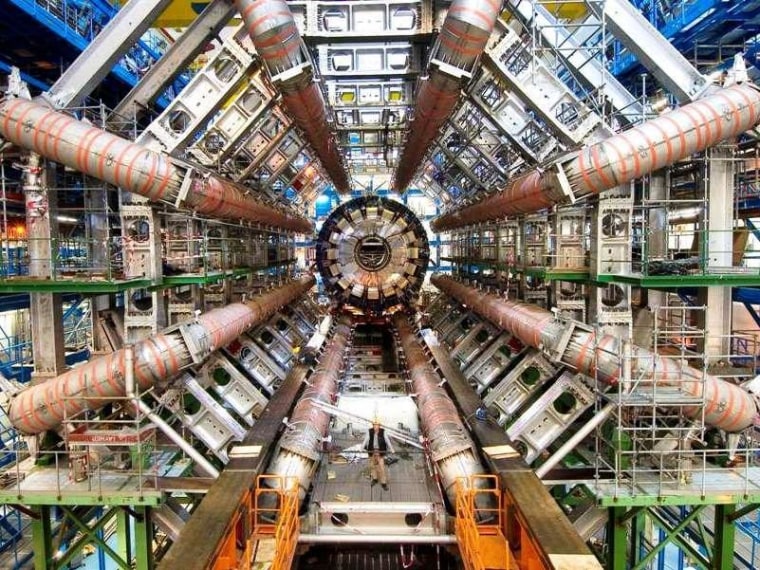 The Large Hadron Collider, shown here during its construction phase, is the locale where physicists hope many of their most puzzling cases will be solved. But there are other mysteries to ponder in the cosmos.