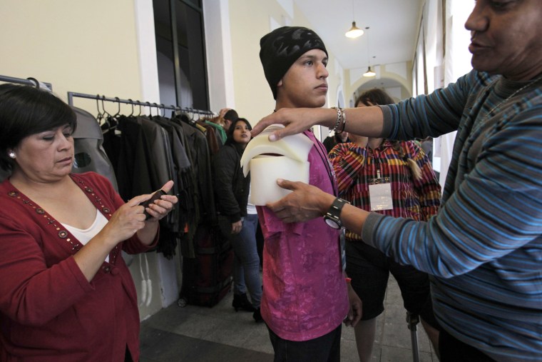 Eric Salas from Venezuela, who lost his right arm to cancer, is prepared to model clothing at Bionic Fashion Day.