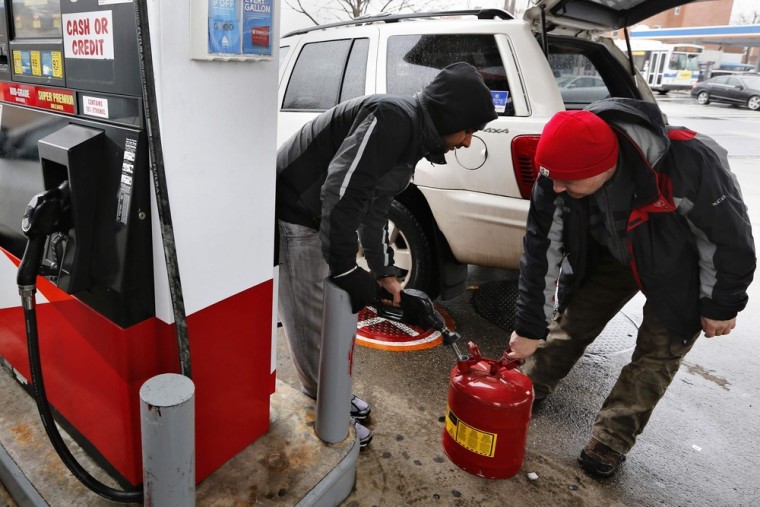 A man fills up a gas tank at a fuelling station in the Queens borough of New York February 8, 2013.