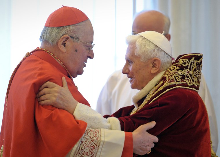 The pope and Cardinal Angelo Sodano, Dean of the College of Cardinals, hug each other after the pontiff announced that he would abdicate on Feb. 28.