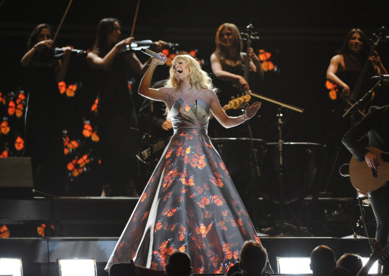 Butterflies and flowers danced across Carrie Underwood's dress.