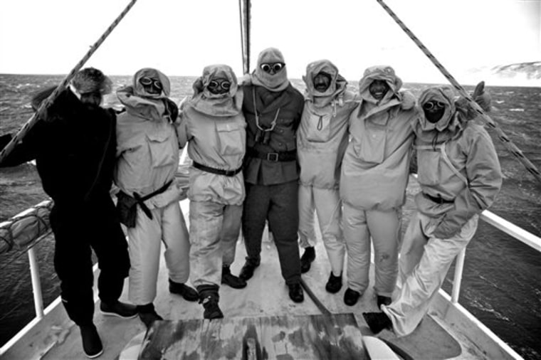 In this Jan. 8, 2013 photo released by Shackleton Epic, expedition members and an unidentified supporter pose on the deck of their boat Alexander Shac...