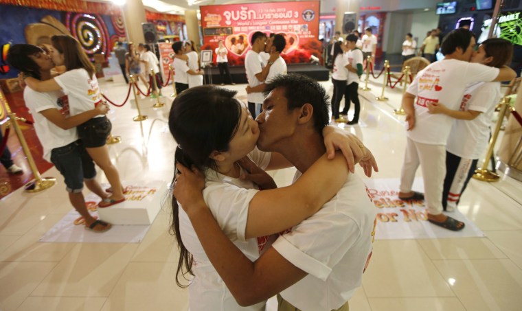 Ekkachai Tiranarat, 44, kisses his wife Laksana Tiranarat, 33, front left, in an attempt to break the Guinness World Record for the longest continuous kiss, as part of the upcoming Valentine's Day celebration in Pattaya, Chonburi province, Thailand, on Feb. 12.