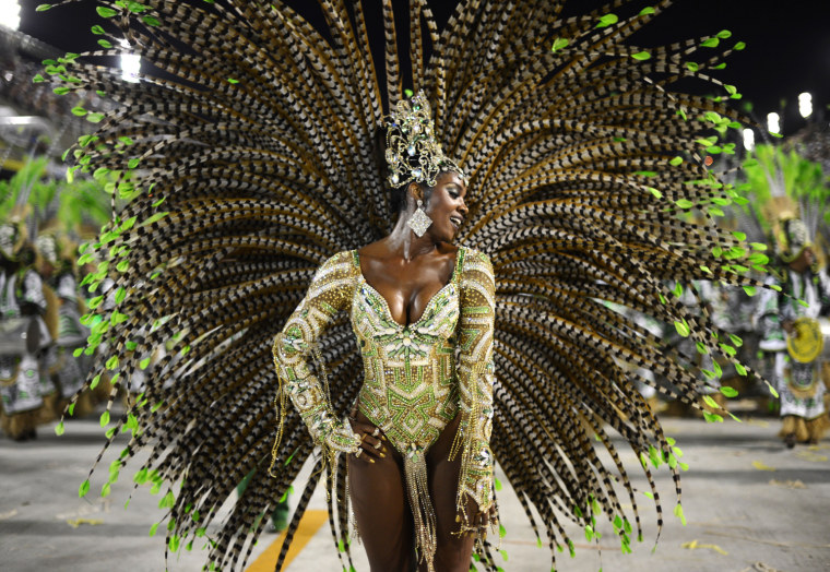 Gold and feathered samba dancers spice up Carnival celebrations in Rio