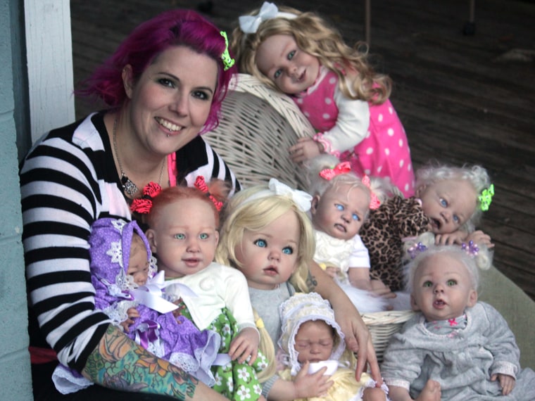 Mama and her monsters: Artist Bean Shanine, with some of her vampire and zombie reborn dolls.