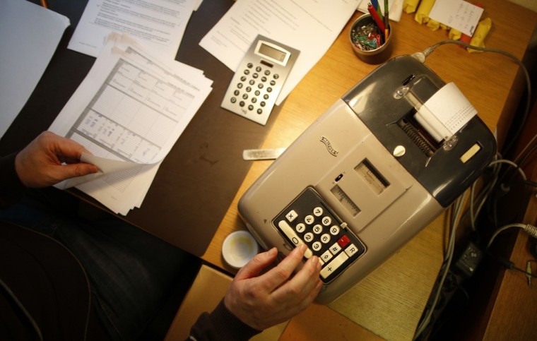 Peter Breiter works with an old adding-machine. The bank is not connected to a database system, there are no cash machines and its customer base consists only of residents of the town of Gammesfeld which has a population of around 510.