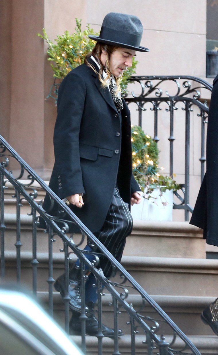 Former Christian Dior designer, John Galliano, leaves a New York City apartment in a hat and ringlets that inspired controversy.