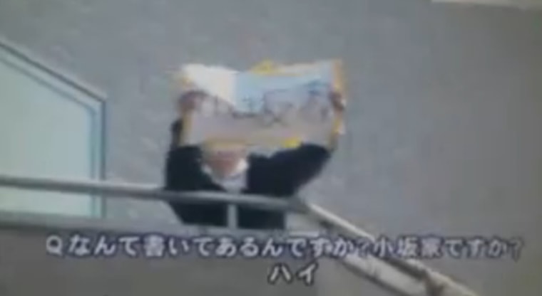 Kosaka's sister held up a sign stating \"we are all safe\" in hopes that a news crew would catch the message on video.