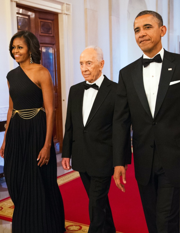 Look familiar? Michelle Obama wearing Michael Kors while escorting Israeli President Shimon Peres for a dinner where he would be presented with the Presidential Medal of Freedom on June 13 at the White House.