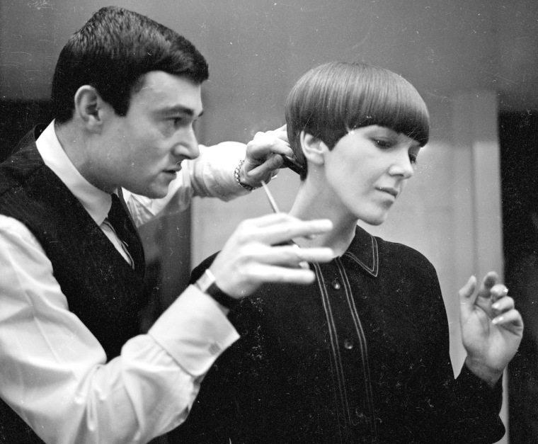 In this 1964 photo, clothing designer Mary Quant, one of the leading lights of the British fashion scene in the 1960s, is pictured having her hair cut by hairdresser Vidal Sassoon.
