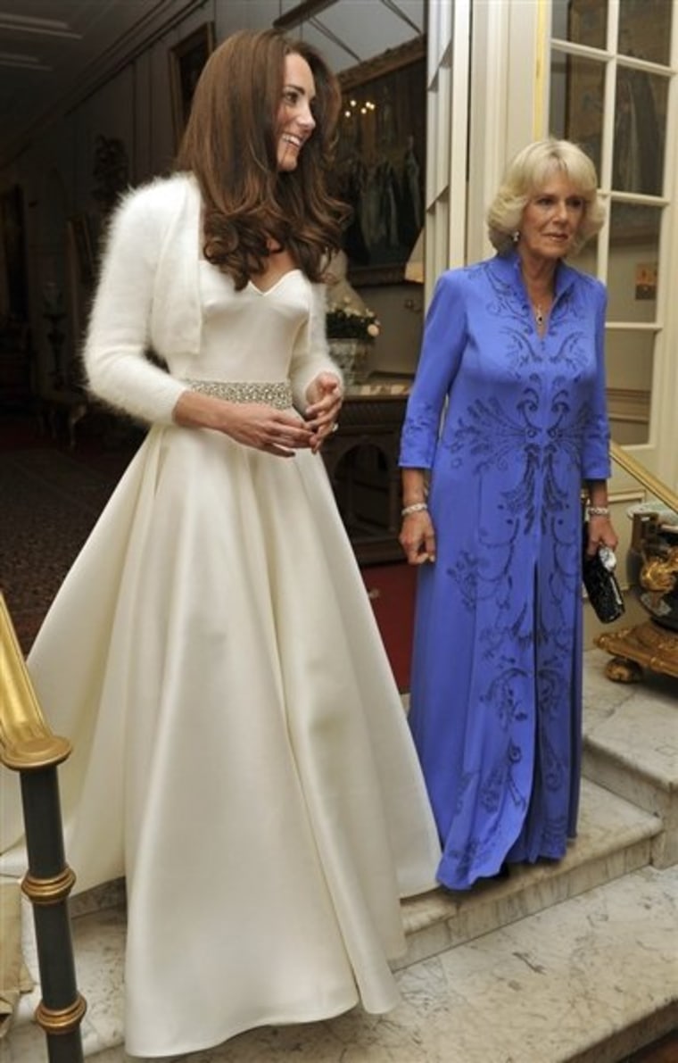 Kate, the Duchess of Cambridge, left, leaves Clarence House, London, with Camilla, the Duchess of Cornwall to travel to Buckingham Palace for the evening celebrations following her wedding to Britain's Prince William, Friday April 29, 2011.
