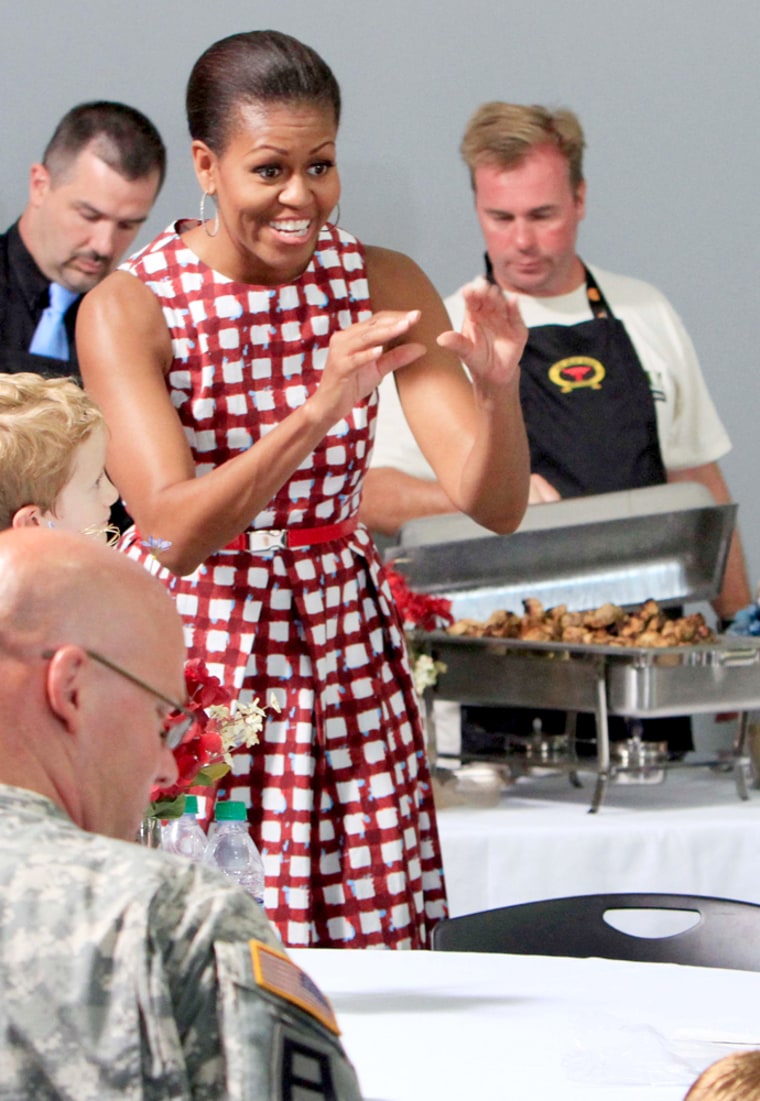 First lady Michelle Obama wears an ASOS dress at the Joining Forces Cookout for National Guard and Reserve and Active Duty members and their families on Sunday, July 24.