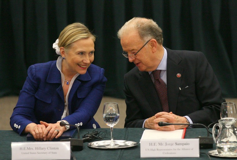 Hillary Clinton listens to Portugal's former president and UN High Representative Jorge Sampaio as they take part in the Community Of Democracies ministerial conference in Vilnius on July 1, 2011.