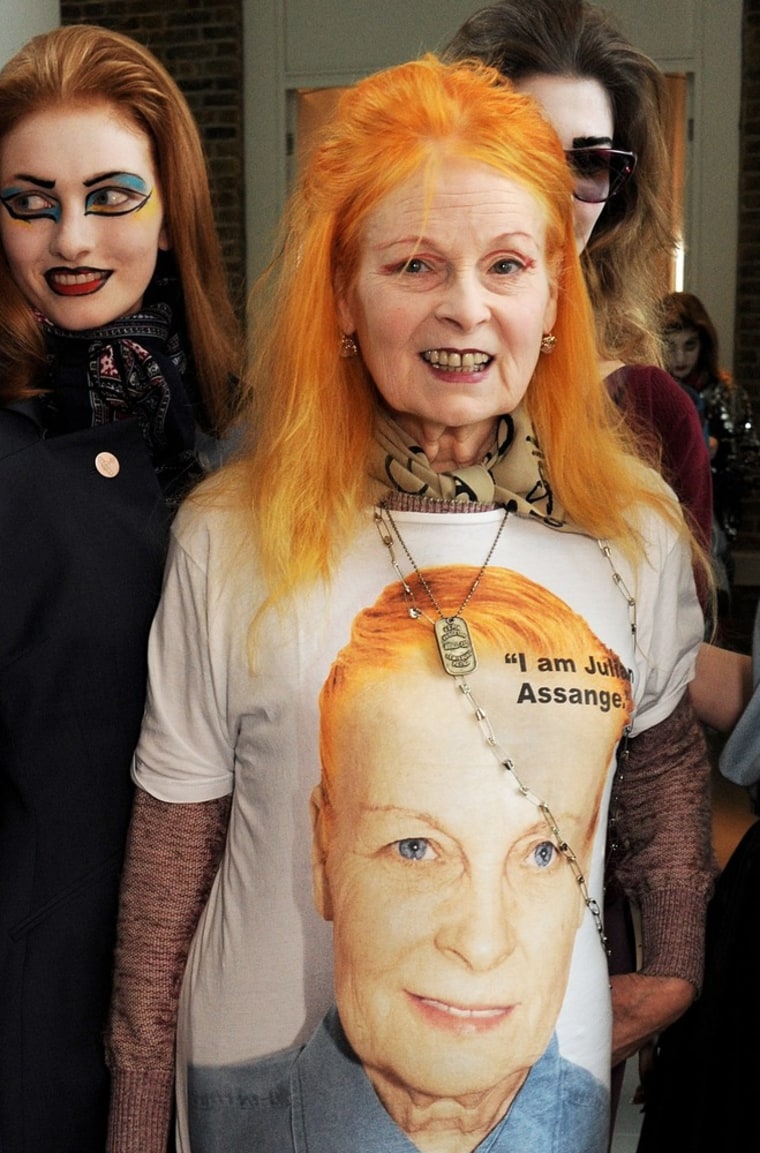 Designer Vivienne Westwood supports Julian Assange on the catwalk