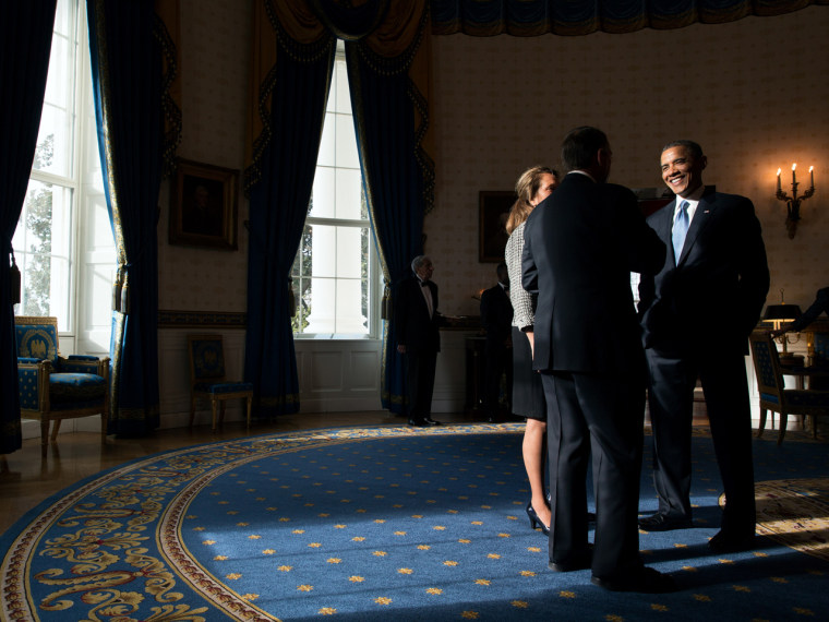 President Obama talks with House Speaker John Boehner and his wife, Debbie Boehner.