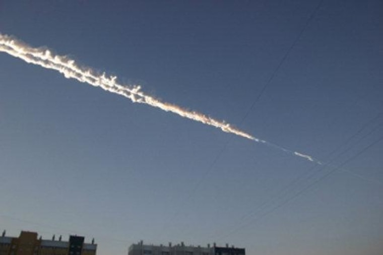 What appears to be a meteor trail over eastern Russian is seen in this image released Friday by the Russian Emergency Ministry. The meteor fall included a massive blast.