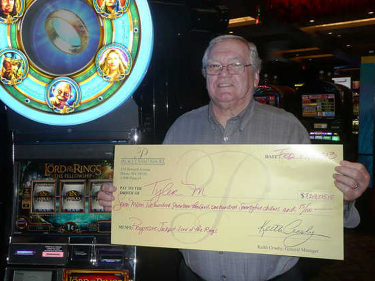 Tyler Morris with his winnings at the Palace Casino Resort.