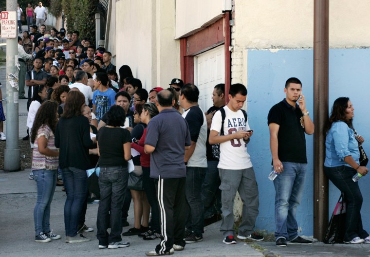 People line up for assistance with paperwork for the Deferred Action for Childhood Arrivals program at the Coalition for Humane Immigrant Rights of Los Angeles in Los Angeles, California, August 15, 2012.