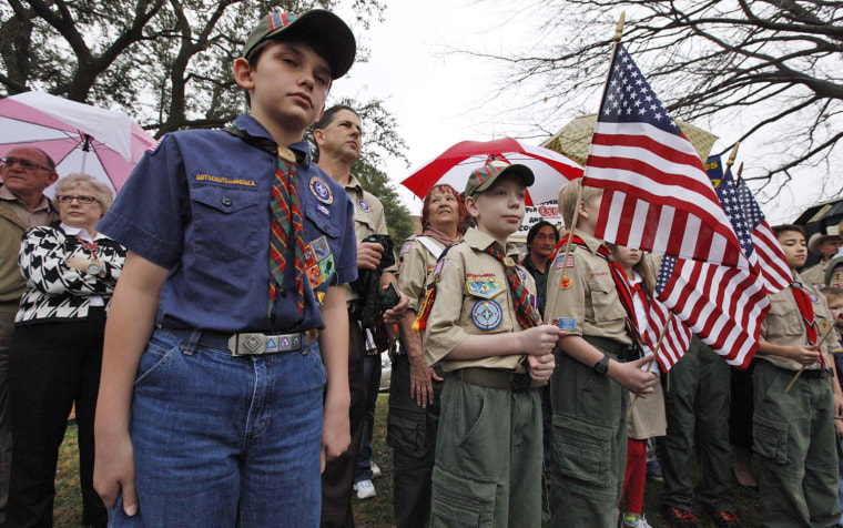 Scouts attend a prayer vigil at the Boy Scouts of America headquarters in Irving, Texas, on Feb. 6, 2013, while a decision to change the membership policy banning gays was being deliberated. The BSA decided to postpone that decision until May.