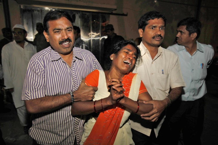 Sujatha is overcome after seeing her husband Venkateshwarulu's body at a mortuary in Hyderabad, India, on Feb. 21. Her husband was killed in a pair of blasts in a crowded shopping area.