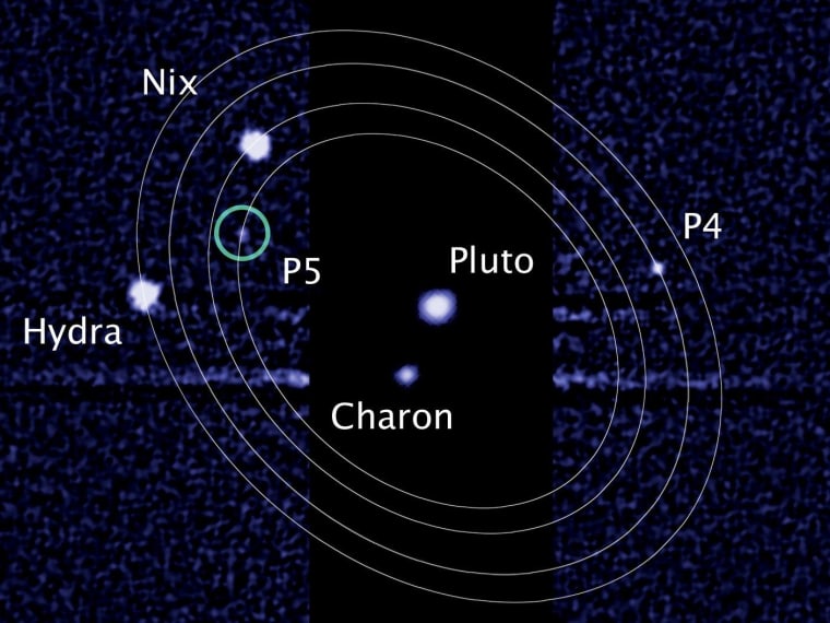 An image from the Hubble Space Telescope shows Pluto and its largest moon, Charon, surrounded by four smaller moons. P4 and P5 will be getting new names. One of them might be called Vulcan.