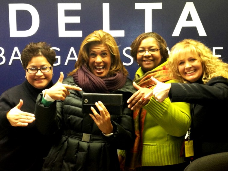 Reunited with her wallet, Hoda poses with the Delta staff.