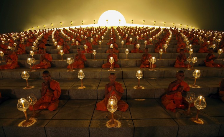 Thousands of Thai Buddhist monks chant during a lantern lighting to celebrate Makha Bucha day at Dhammakaya Temple in Pathum Thani province, on the outskirts of Bangkok, Thailand, Feb. 25, 2013.