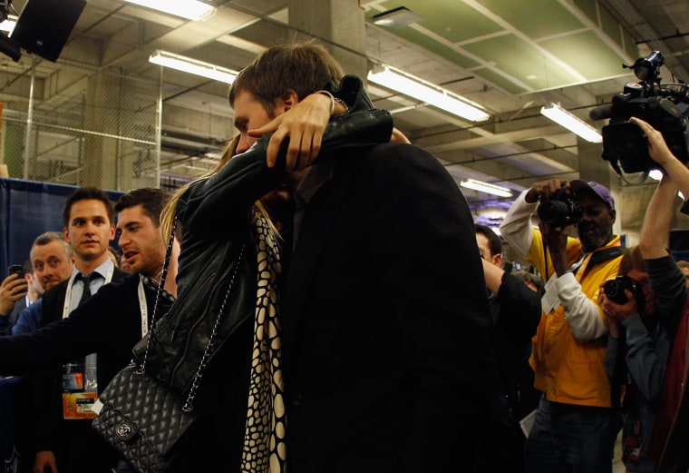 Gisele goes in for a strong hug following the loss to the New York Giants.