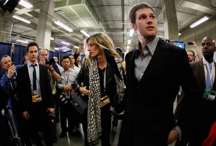 The gorgeous duo hold court before photographers following the Super Bowl.