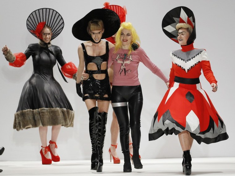 Designer Pam Hogg walks down the catwalk with her models after the presentation of the Pam Hogg 2012 Autumn/Winter collection during London Fashion Week on Feb. 19.
