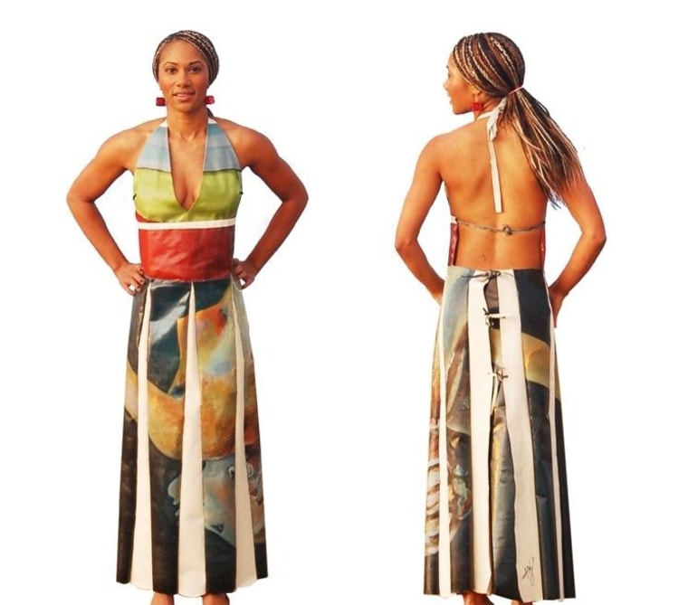 Artist Keariene Muizz poses in the dress she made entirely out of one of her oil paintings.