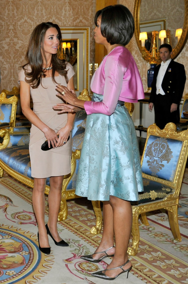 In May, Obama wore a short pink bolero jacket and silk dress to meet the new Duchess of Cambridge at Buckingham Palace in London.