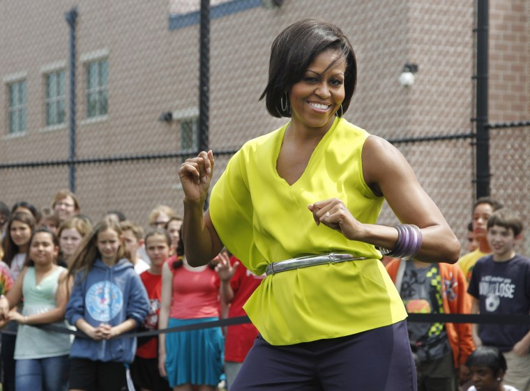 The first lady sported a bright neon top to dance with students at a middle school in in northwest Washington, DC in May.