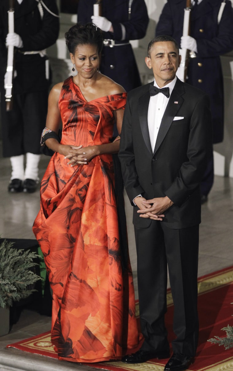 Michelle Obama donned a dramatic red silk organza dress for the January 19, 2011 state dinner. The dress was designed by the designer of Kate Middleton's wedding gown, Sarah Burton of Alexander McQueen.