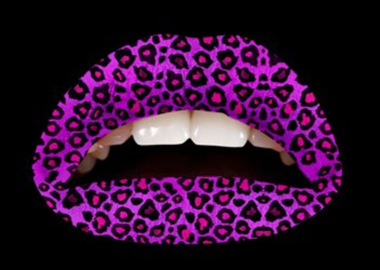 Bored with red lipstick? Try Violent Lips' purple cheetah lip applique.