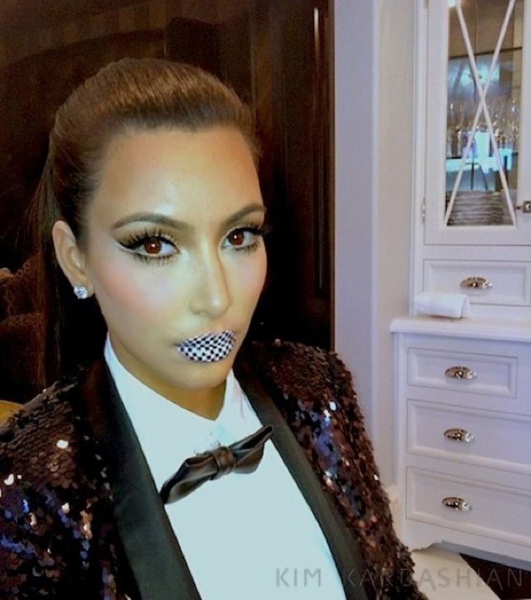 Way to make a statement: Kim Kardashian models Violent Lips' lip tattoos.