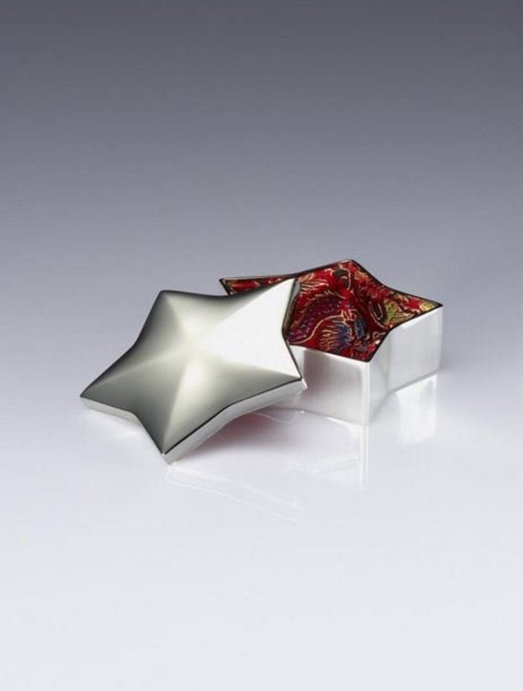 A brocade-lined, star-shaped, silver plated box that houses Shanghai Tang cufflinks